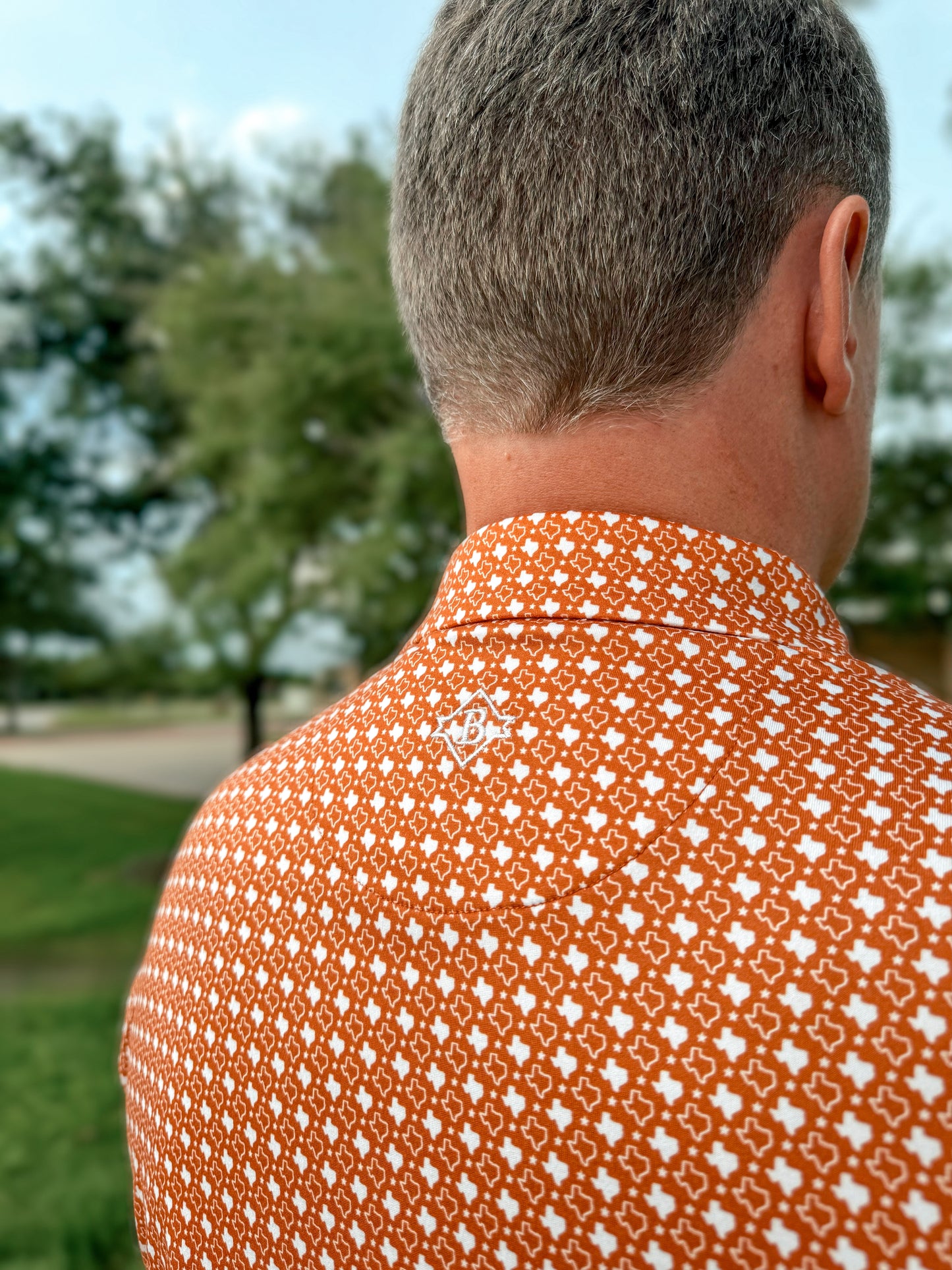 Burlebo Men’s orange Texas polo - Ethan and Emily